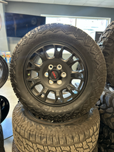 Load image into Gallery viewer, OEM '24-'26 Toyota Tacoma TRD Black Used Wheels 265/65R18 Nitto Nomad Grappler