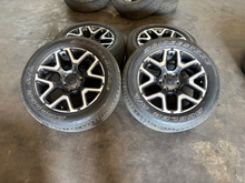 Load image into Gallery viewer, OEM '19-'26 RAM 1500 Charcoal Machined Used Rims 275/55R20 Bridgestone Tires LT