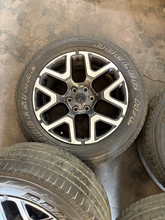 Load image into Gallery viewer, OEM '19-'26 RAM 1500 Charcoal Machined Used Rims 275/55R20 Bridgestone Tires LT
