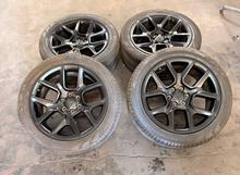 Load image into Gallery viewer, Set of 4 Used Black '19-'26 RAM 1500 22" Wheels 285/45R22 Pirelli All Season LT
