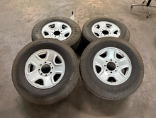 Load image into Gallery viewer, Set of 4 Used 18" '05-'26 Dodge RAM 2500 Steel Wheels 275/70R18 Firestone HT LT