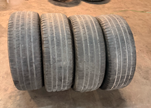 Load image into Gallery viewer, Set of 4 Used 22" '19-'26 RAM 1500 Matte Black Wheels 285/45R22 Pirelli Tires LT