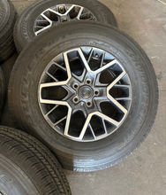 Load image into Gallery viewer, OEM '07-'26 Jeep Wrangler 18" Used Wheels on 255/70R18 Bridgestone HT Tires LT