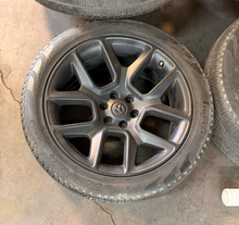 Load image into Gallery viewer, Set of 4 Used OEM 22" '19-'26 RAM 1500 Black Rims 285/45R22 Pirelli Scorpion LT