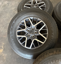 Load image into Gallery viewer, OEM '07-'26 Jeep Wrangler 18" Used Wheels on 255/70R18 Bridgestone HT Tires LT