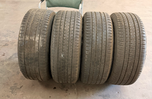 Load image into Gallery viewer, Set of Used Black '19-'26 RAM 1500 OEM Wheels 275/55R20 Bridgestone HL Tires LT