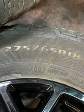 Load image into Gallery viewer, Set of Used '05-'26 Ford F150 Gloss Black Wheels 275/65R18 Goodyear AT Tires LT