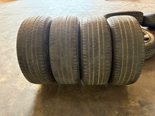 Load image into Gallery viewer, OEM '19-'26 RAM 1500 Charcoal Machined Used Rims 275/55R20 Bridgestone Tires LT
