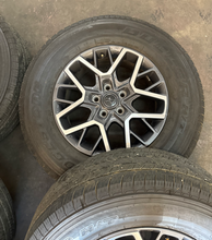 Load image into Gallery viewer, OEM '07-'26 Jeep Wrangler 18" Used Wheels on 255/70R18 Bridgestone HT Tires LT