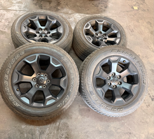 Load image into Gallery viewer, Set of OEM Used '19-'26 RAM 1500 Black Clad Wheels 275/55R20 Bridgestone H/L LT