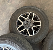Load image into Gallery viewer, OEM '07-'26 Jeep Wrangler 18" Used Wheels on 255/70R18 Bridgestone HT Tires LT