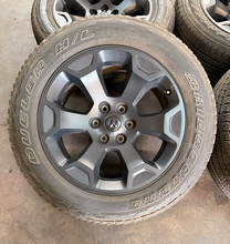 Load image into Gallery viewer, Set of Used 20" '19-'26 RAM 1500 2462 Black Clad Wheels 275/55R20 Bridgestone LT