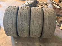 Load image into Gallery viewer, Set of Used '19-'26 RAM 1500 2727 Dark Charcoal Rims 285/45R22 Open Range HTS LT