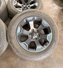 Load image into Gallery viewer, Set of Used 20" '19-'26 RAM 1500 2462 Black Clad Wheels 275/55R20 Bridgestone LT
