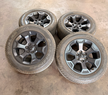 Load image into Gallery viewer, Set of Used 20" '19-'26 RAM 1500 2462 Black Clad Wheels 275/55R20 Bridgestone LT