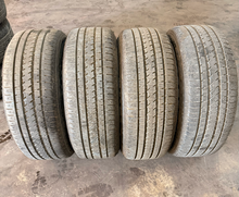Load image into Gallery viewer, Set of OEM Used '19-'26 RAM 1500 Black Clad Wheels 275/55R20 Bridgestone H/L LT