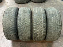 Load image into Gallery viewer, Set of Used '05-'26 Ford F150 Gloss Black Wheels 275/65R18 Goodyear AT Tires LT