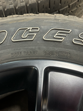 Load image into Gallery viewer, Set of 4 Used 20" Black '19-'26 RAM 1500 OEM Wheels 275/55R20 Bridgestone H/L LT