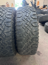 Load image into Gallery viewer, OEM '05-'26 RAM 2500 Power Wagon Used Black Rims 285/70R17 Goodyear Duratrac LT