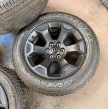 Load image into Gallery viewer, Set of Used 20" '19-'26 RAM 1500 Matte Black Wheels on 275/55R20 Bridgestone LT