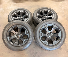 Load image into Gallery viewer, Set of Used 20" '19-'26 RAM 1500 Matte Black Wheels on 275/55R20 Bridgestone LT