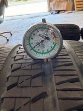 Load image into Gallery viewer, Set of Used 20" Matte Black '19-'26 RAM 1500 OEM Wheels 275/55R20 Bridgestone LT