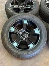 Load image into Gallery viewer, Set of Used '19-'25 RAM 1500 Black OEM Wheels on 275/55R20 Bridgestone Tires LT