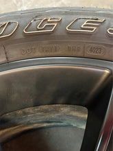 Load image into Gallery viewer, Set of Used '19-'25 RAM 1500 Black OEM Wheels on 275/55R20 Bridgestone Tires LT