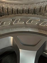 Load image into Gallery viewer, Set of 4 Used OEM '19-'25 RAM 1500 Big Horn Black Wheels on 275/55R20 Tires LT