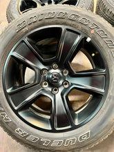 Load image into Gallery viewer, Set of Four Used 20" Black '19-'25 RAM 1500 Rims on 275/55R20 Bridgestone OWL LT