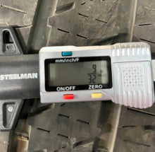 Load image into Gallery viewer, Set of Four Used 20" Black '19-'25 RAM 1500 Rims on 275/55R20 Bridgestone OWL LT