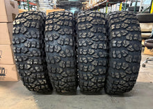 Load image into Gallery viewer, Set of 4 OEM 17" '05-'26 Dodge RAM 2500 3500 Black Rims 37/12.50R17 Yokohama XMT