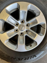 Load image into Gallery viewer, Set of 4 Used 18" Silver '19-'25 RAM 1500 Rims 275/65R18 Goodyear Fortitude LT