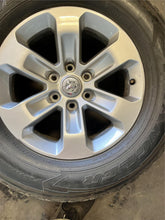 Load image into Gallery viewer, Set of 4 Used 18" Silver '19-'25 RAM 1500 Rims 275/65R18 Goodyear Fortitude LT