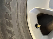 Load image into Gallery viewer, Set of 4 Used 18" Silver '19-'25 RAM 1500 Rims 275/65R18 Goodyear Fortitude LT