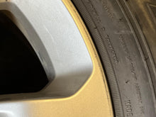 Load image into Gallery viewer, Set of 4 Used 18" Silver '19-'25 RAM 1500 Rims 275/65R18 Goodyear Fortitude LT