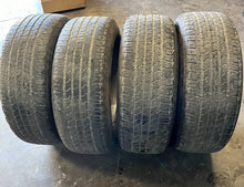 Load image into Gallery viewer, Set of 4 Used 18" Silver '19-'25 RAM 1500 Rims 275/65R18 Goodyear Fortitude LT