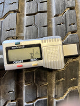 Load image into Gallery viewer, Set of 4 Used 18" Silver '19-'25 RAM 1500 Rims 275/65R18 Goodyear Fortitude LT