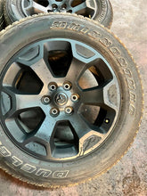 Load image into Gallery viewer, Set of 4 OEM Black '19-'25 RAM 1500 Wheels 275/55R20 Bridgestone Alenza Tires LT