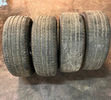 Load image into Gallery viewer, Set of 4 OEM Black '19-'25 RAM 1500 Wheels 275/55R20 Bridgestone Alenza Tires LT