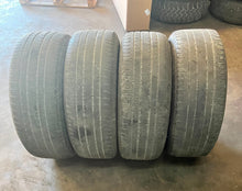 Load image into Gallery viewer, Set of Four Used 20" Black '19-'25 RAM 1500 Wheels 275/55R20 Bridgestone HL LT