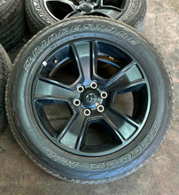 Load image into Gallery viewer, Set of Four Used 20" Black '19-'25 RAM 1500 Rims on 275/55R20 Bridgestone RWL LT