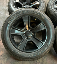 Load image into Gallery viewer, Set of Four Used 20" Black '19-'25 RAM 1500 Rims on 275/55R20 Bridgestone RWL LT