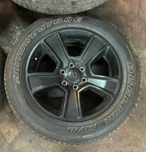 Load image into Gallery viewer, Set of Four Used 20" Black '19-'25 RAM 1500 Rims on 275/55R20 Bridgestone RWL LT