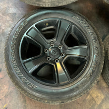 Load image into Gallery viewer, Set of Four Used 20" Black '19-'25 RAM 1500 Rims on 275/55R20 Bridgestone RWL LT
