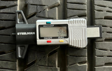 Load image into Gallery viewer, Set of Four Used 20" Black '19-'25 RAM 1500 Rims on 275/55R20 Bridgestone RWL LT