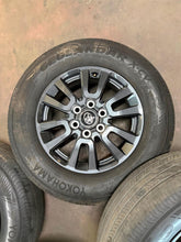 Load image into Gallery viewer, Set of Used 18" OEM '24-'26 Toyota Land Cruiser Wheels on 245/70R18 Yokohama LT