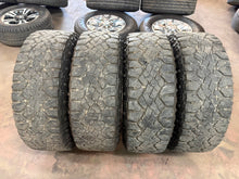 Load image into Gallery viewer, Set of Used 18" '19-'26 RAM 1500 Black Rebel OEM Wheels on 275/70R18 Goodyear LT