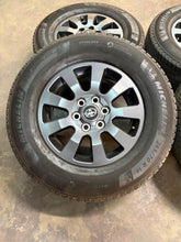 Load image into Gallery viewer, Set of Used '24-'26 Toyota Land Cruiser Charcoal Wheels on 265/70R18 Michelin LT
