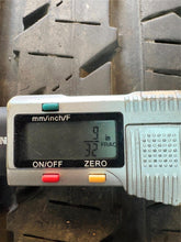 Load image into Gallery viewer, Set of Used Matte Black '19-'25 Dodge RAM 1500 Wheels 275/55R20 Bridgestone LT